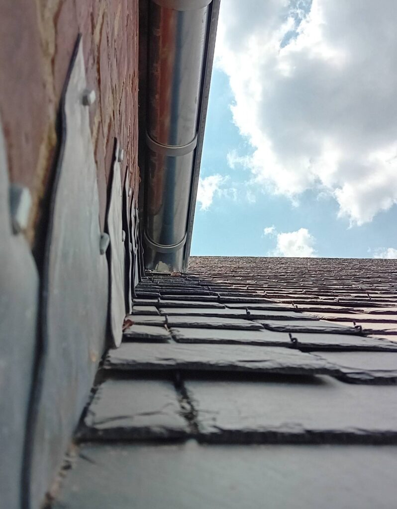 Detail of slate roof installation by Solino